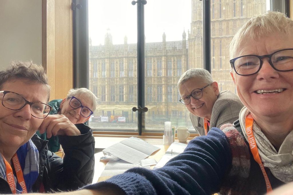 four members of Lesbian Labour inside the Houses of Parliament